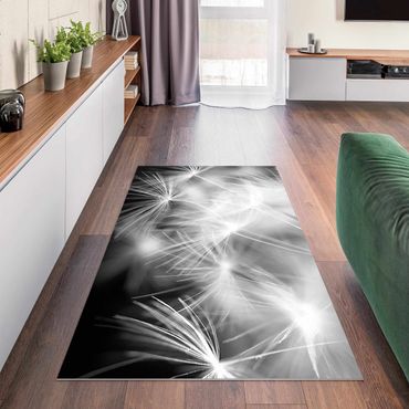 Vinyl Floor Mat - Moving Dandelions Close Up On Black Background - Landscape Format 2:1