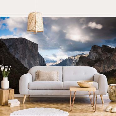 Wallpaper - Clouds Over Mountainous Landscape