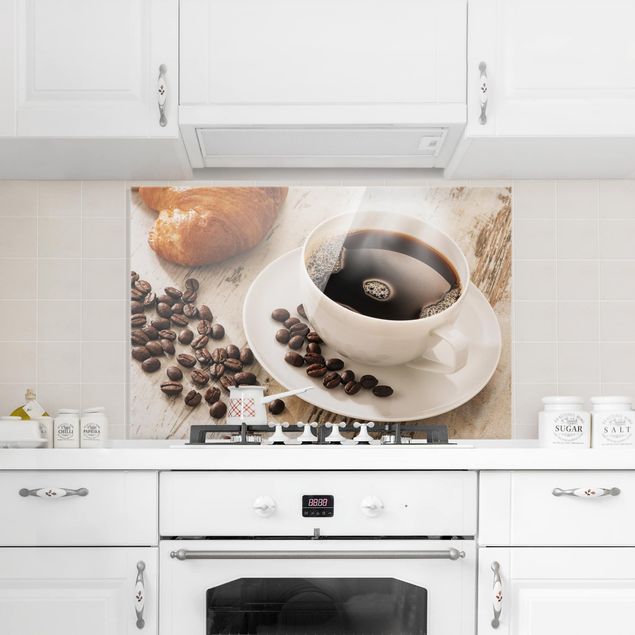 Glass splashbacks Steaming coffee cup with coffee beans