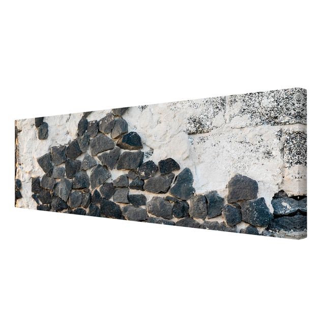Print on canvas - Wall With Black Stones