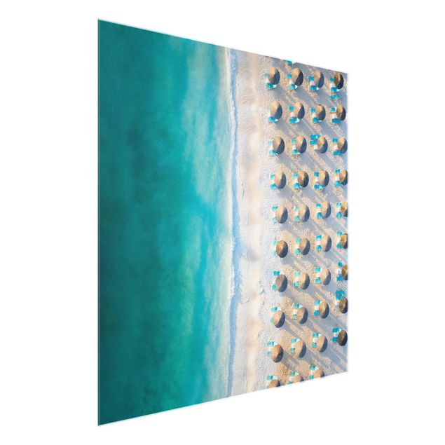 Glass print - White Sandy Beach With Straw Parasols