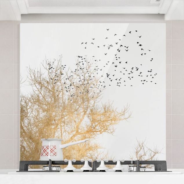 Glass splashback art print Flock Of Birds In Front Of Golden Tree