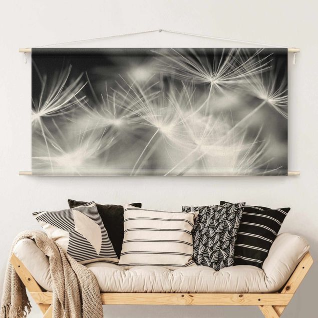 modern tapestry wall hanging Moving Dandelions Close Up On Black Background