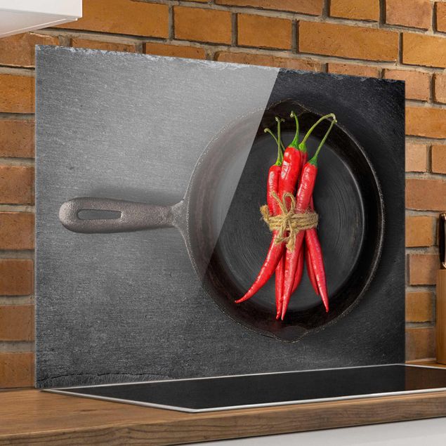 Glass splashback kitchen spices and herbs Bundle Of Red Chillies In Frying Pan On Slate