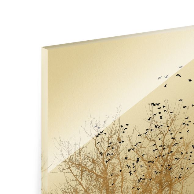 Glass print - Flock Of Birds In Front Of Golden Tree - Portrait format